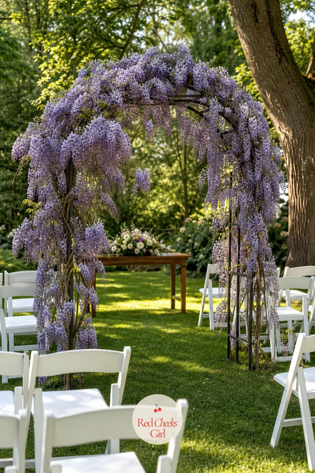 Wisteria Cascade Arch — A bare metal frame at the front of a garden ceremony looks like something still waiting to be finished, and technically it is. Wedding