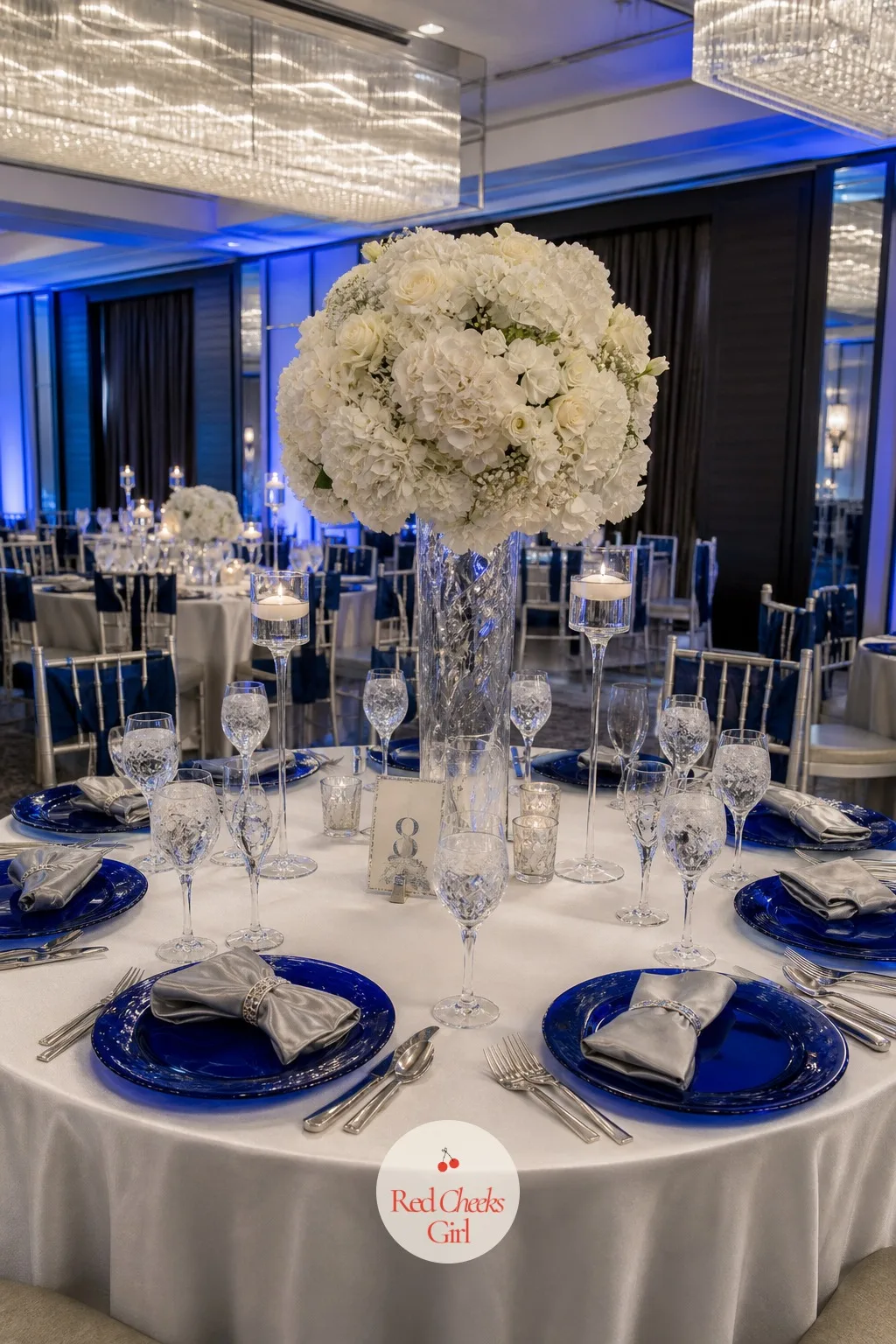 Royal Blue and Silver Table Setting — Royal blue next to silver feels colder and more modern than navy and gold, better suited to a sleek hotel ballroom than a