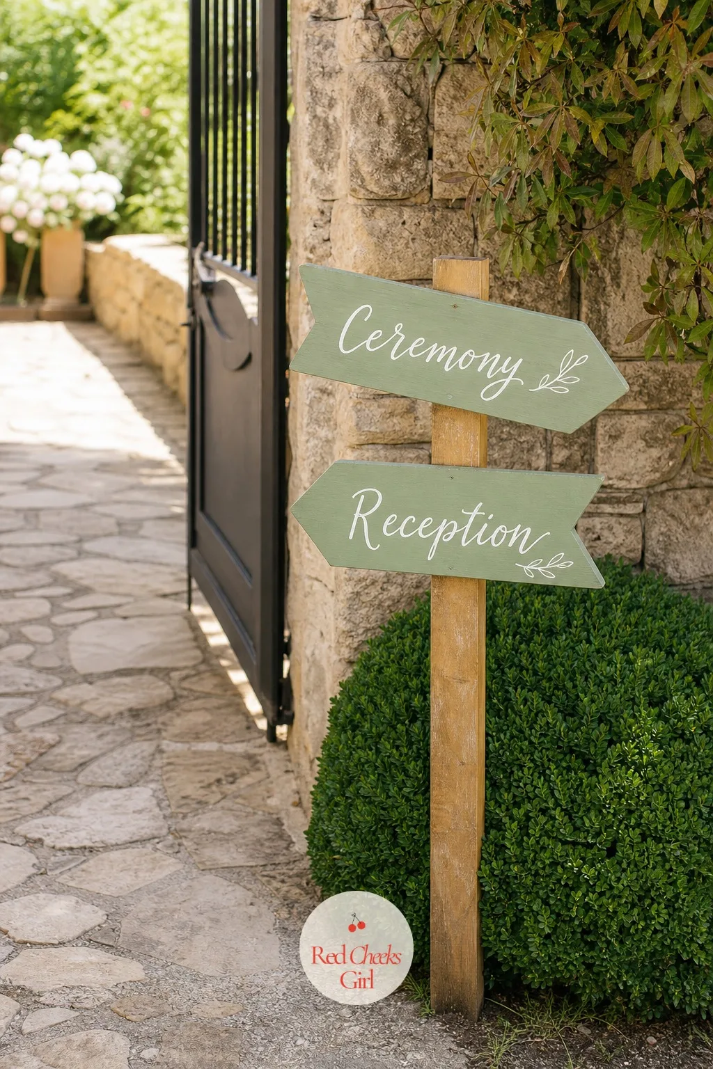 Hand-Painted Wooden Arrow Signpost Stack at the Door — At a venue with more than one space to find, a signpost does what no amount of pretty flowers can: it