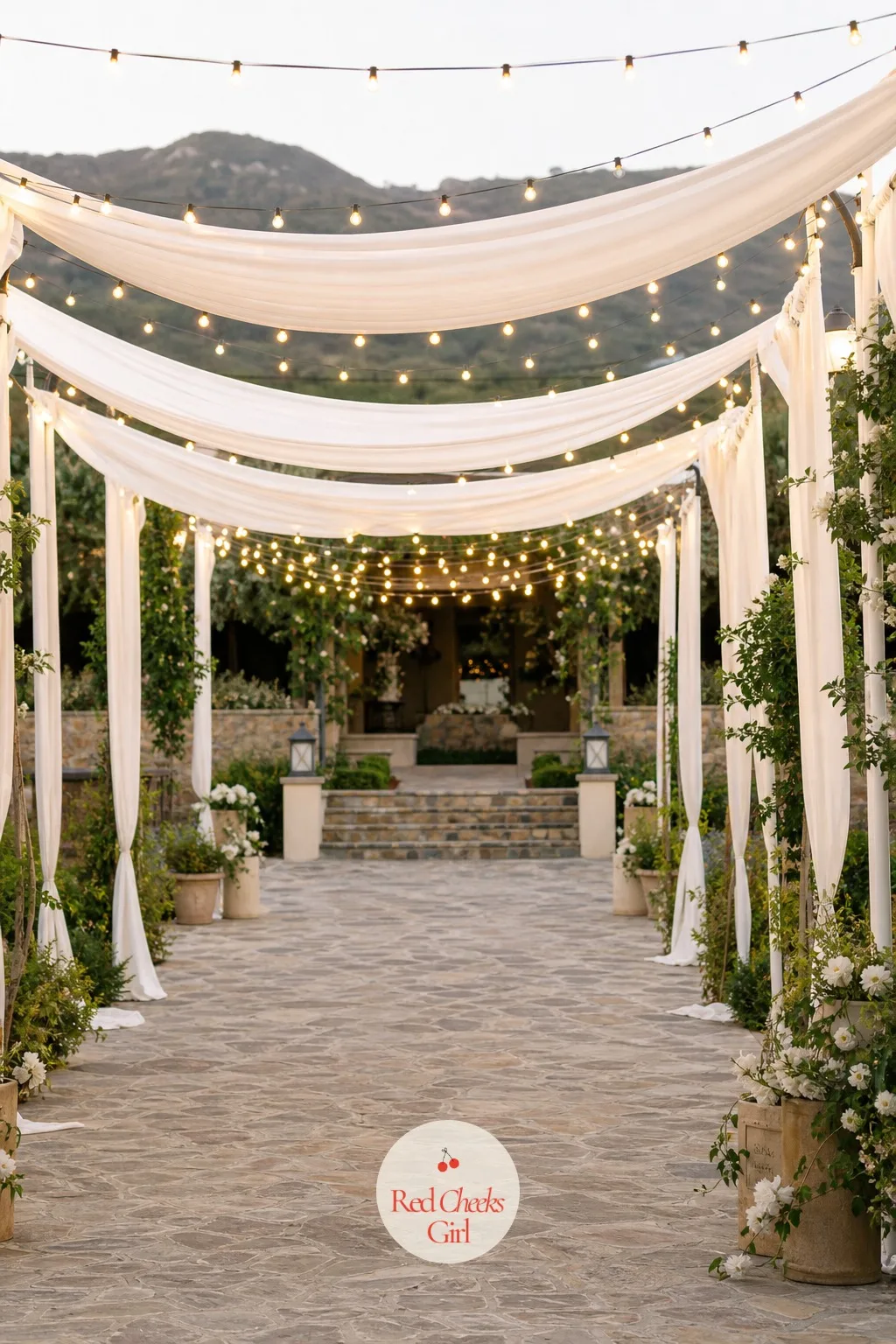 Market Light Canopy Over the Entrance Walkway — Strung overhead the length of the walkway, bulb lights turn a plain courtyard path into the kind of entrance
