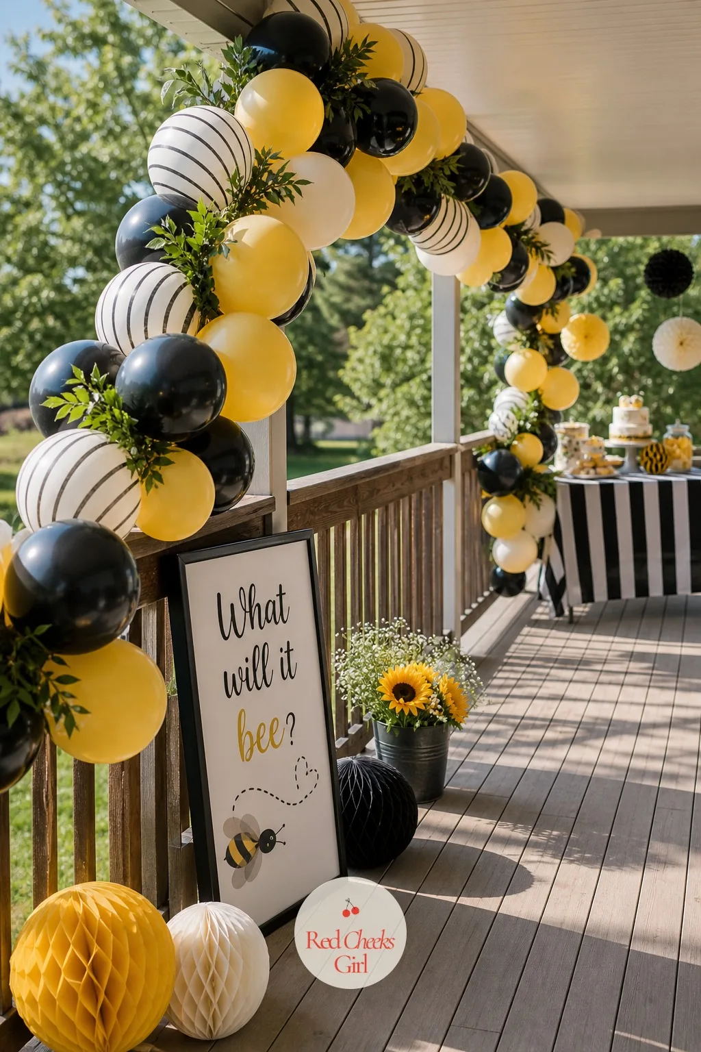 Striped Balloon Arch Pathway — Guests walking from the car to the reveal spot need somewhere to pause and take a photo before the big moment, and an arch along