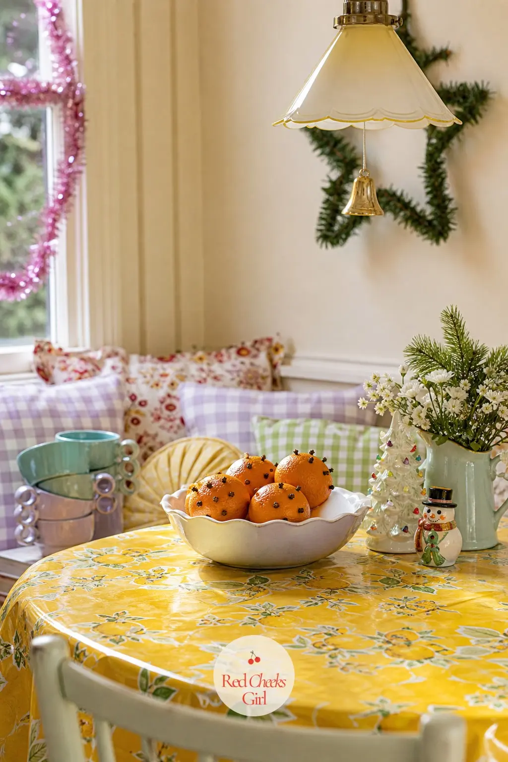 The Breakfast Nook — A small breakfast table gets a lemon yellow oilcloth and a bowl of oranges studded with cloves, the only nod to a classic Christmas smell