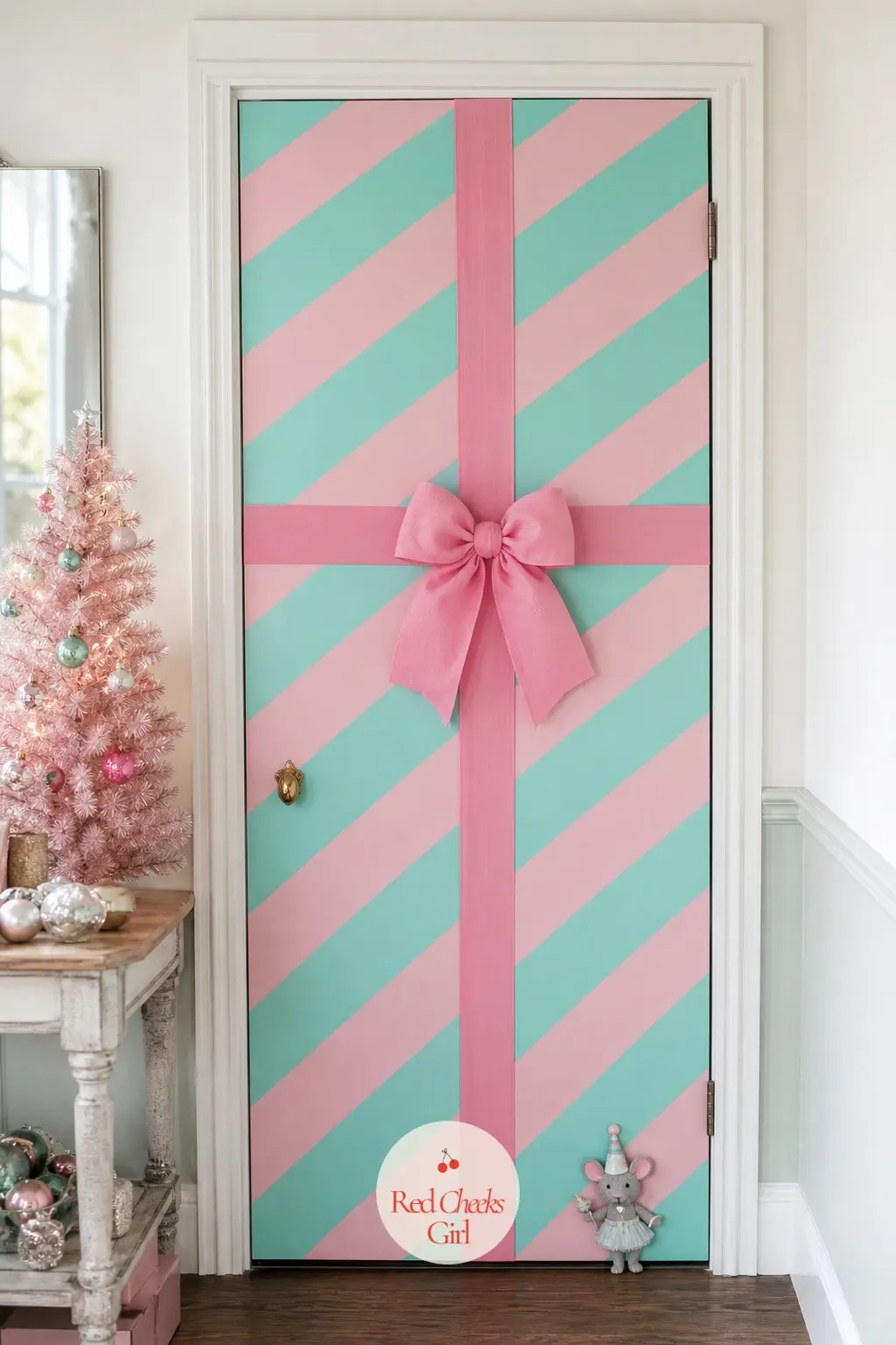 The Closet Door — A plain hall closet door gets a wrap of ribbon in a wide stripe, pink and aqua alternating top to bottom, with a small brass-look knob