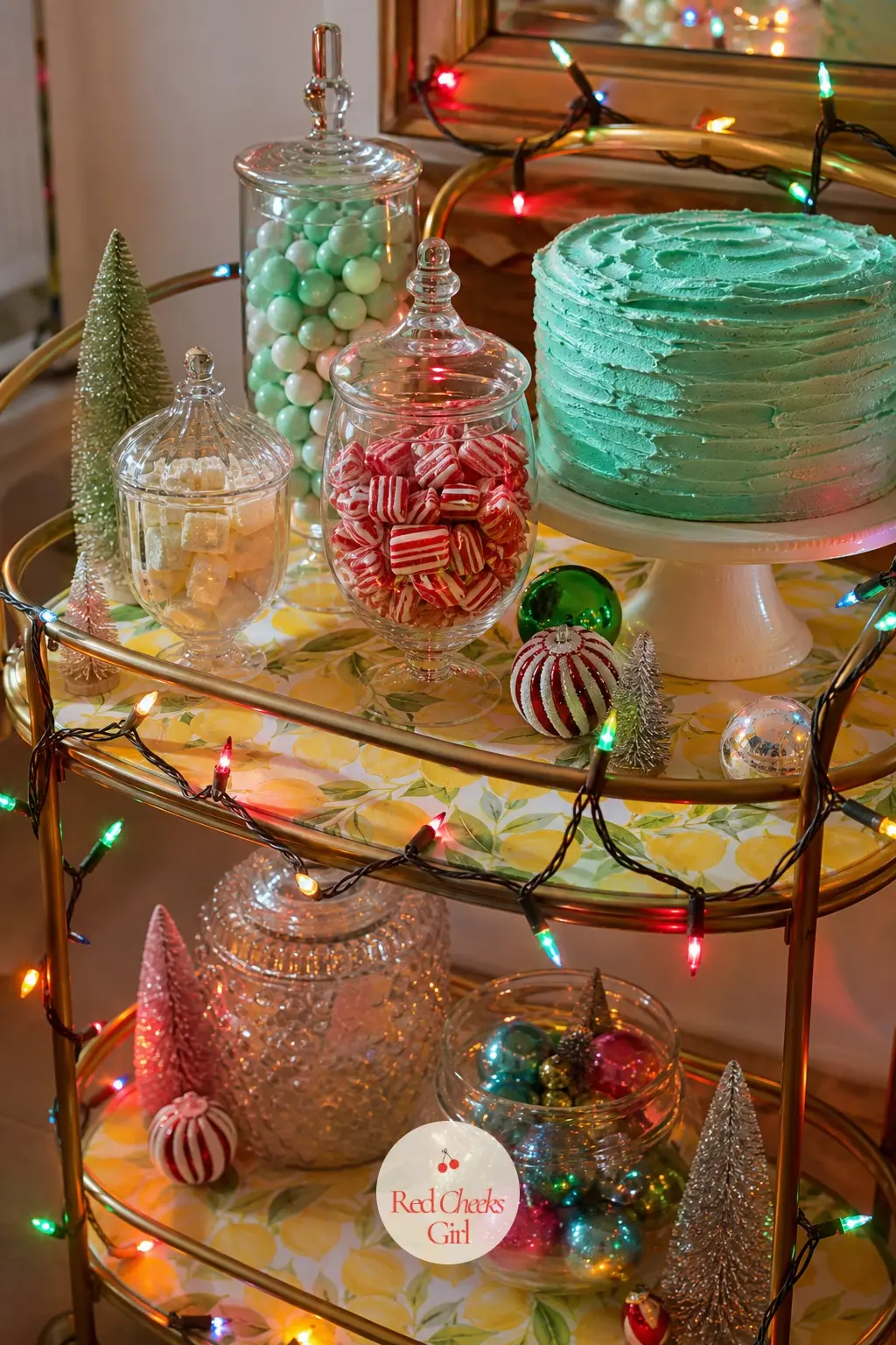 The Dessert Cart — A small bar cart gets repurposed for the season as a dessert cart, its shelves lined in lemon paper and stacked with candy in jars, a cake