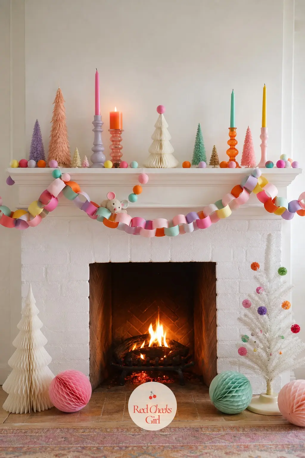 The Mantel and the Fireplace — The garland along the mantel runs in waves of felt leaves and paper rosettes in all five colours rather than a single green
