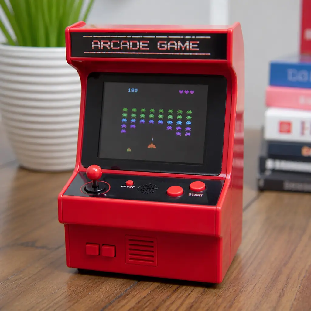 Mini Desktop Arcade Game — Small enough to sit next to a keyboard, distracting enough to actually get used on a slow afternoon. White elephant gift ideas