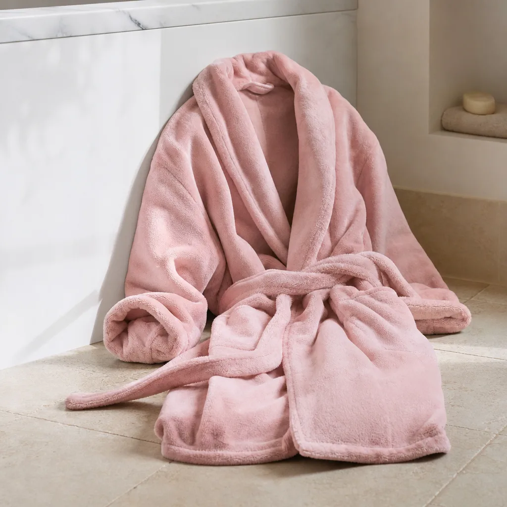 Plush Bathrobe — Some gifts exist purely to be worn the moment she gets home and not taken off until bedtime. Best white elephant gifts