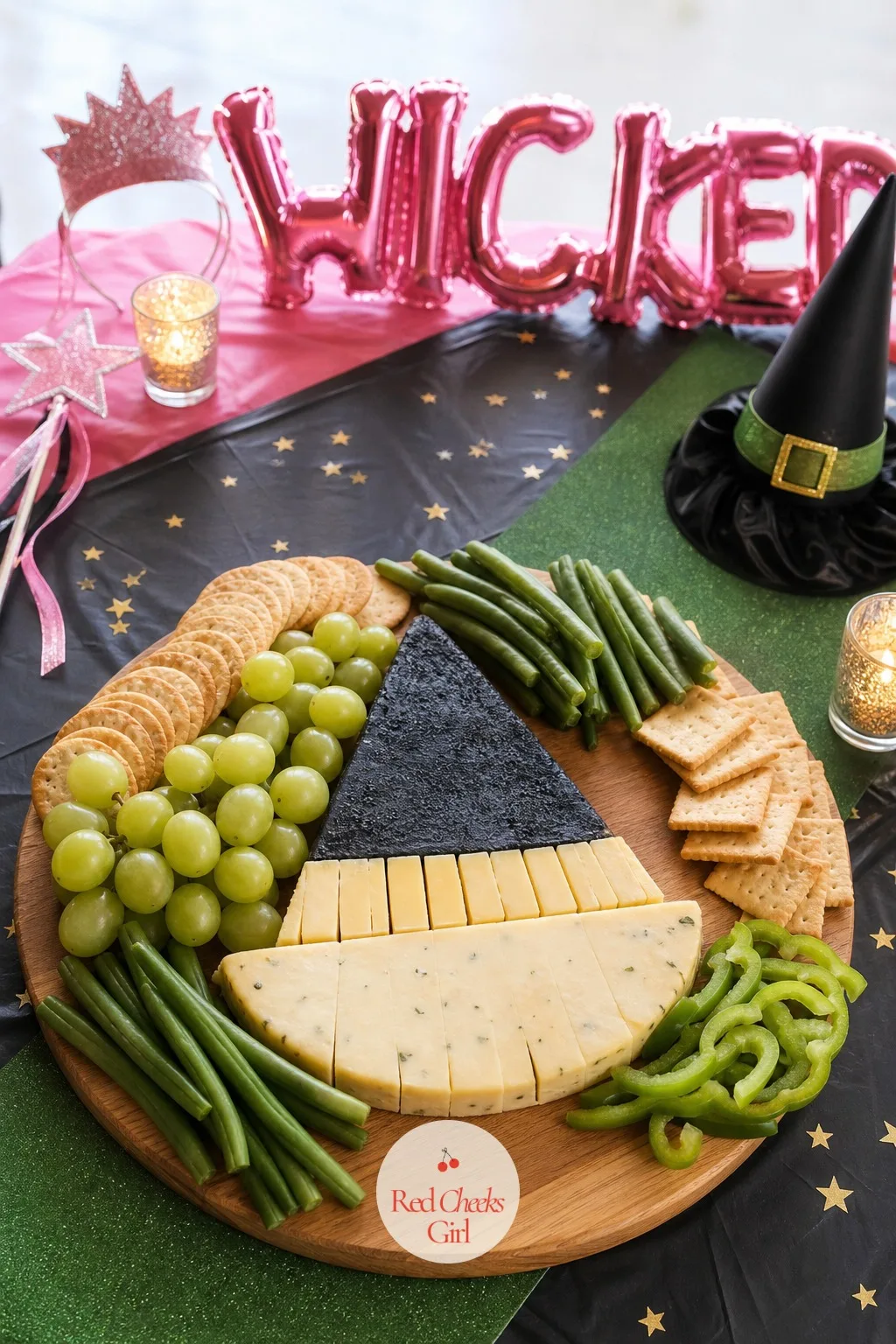 Emerald Veggie and Witch Hat Cheese Board — A plate of plain crackers and dip barely nods at the theme. Wicked party ideas