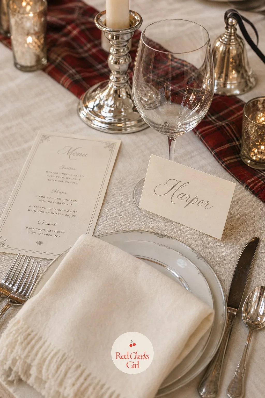 The Place Cards and Menu — Each seat gets one small clue it was thought through: a place card in cream cardstock with each guest's name in silver script