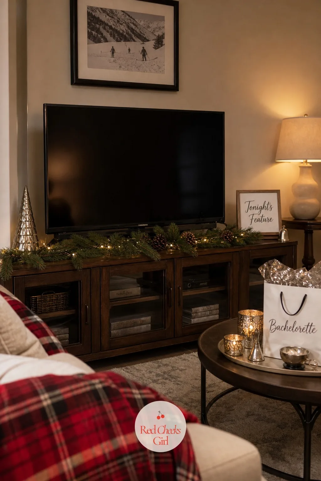 The Screen Styled for the Night — The television itself looks bare between films, so it gets dressed just like the rest of the room instead of ignored. Winter