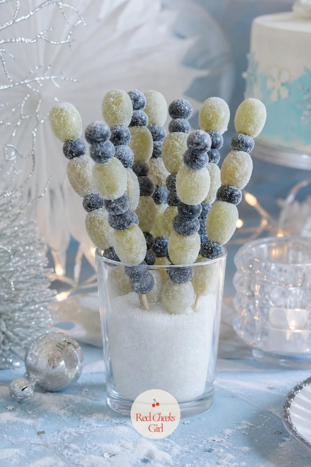 Frosted Berry Icicle Skewers — Not every guest wants more chocolate by the third course, and this is the tray that covers that gap. Winter birthday party ideas