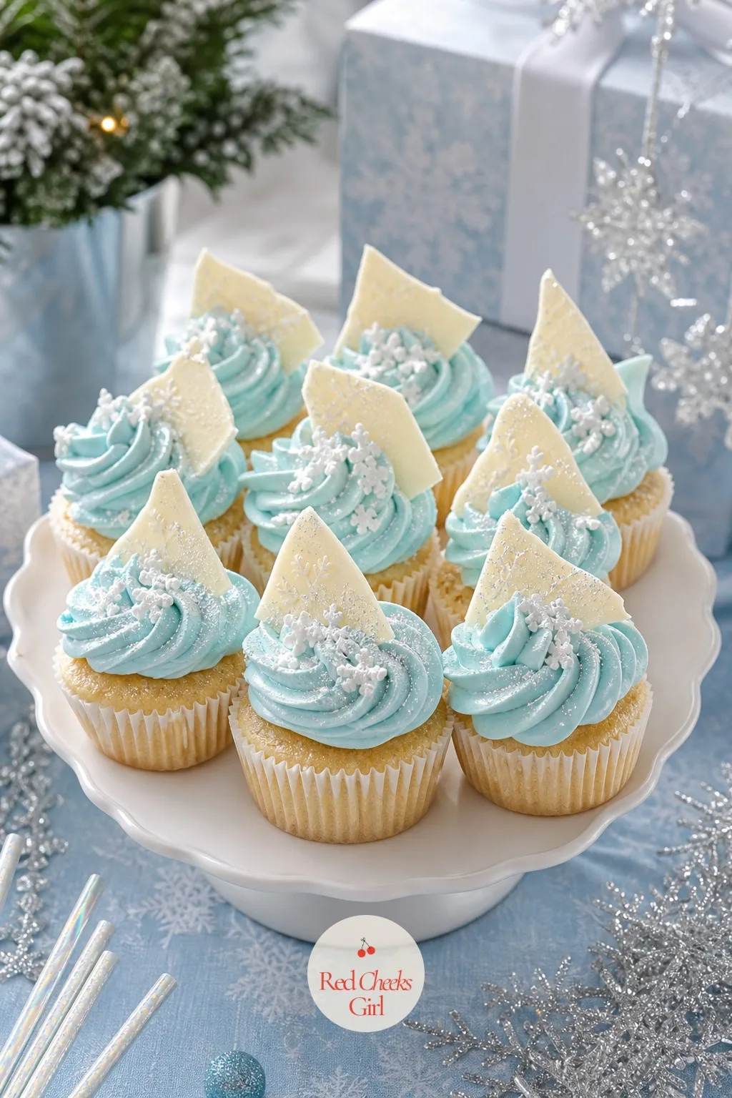 Snowflake Cupcakes With White Chocolate Shards — A plain buttercream swirl is fine, but a shard of white chocolate pressed in at an angle, like a flake