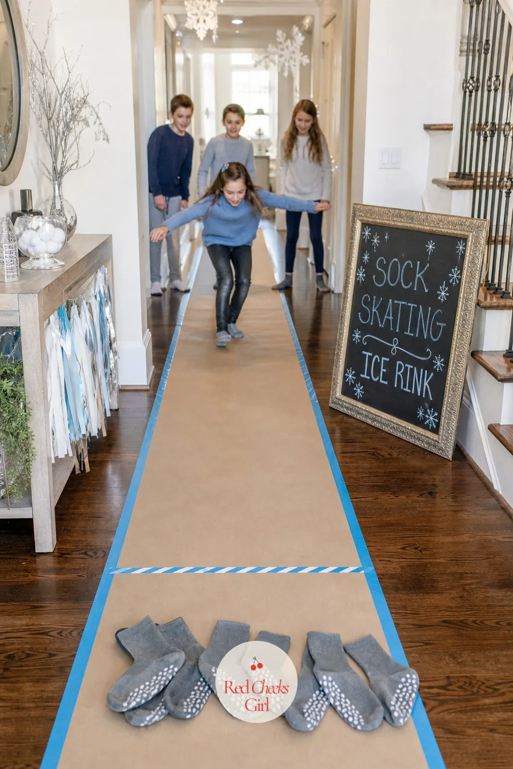 Sock Skating Ice Rink Slide — A long strip of butcher paper taped flat down a hallway, with a finish line marked in washi tape, turns a boring stretch of floor