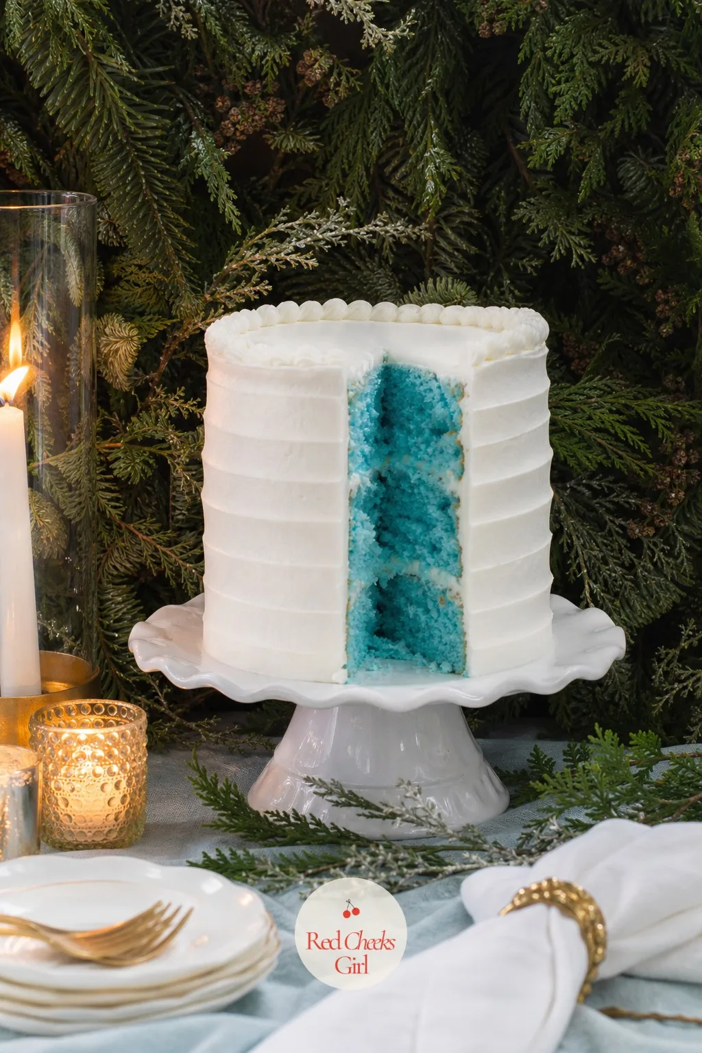 The Cake Cut in Front of a Wall of Evergreens — She would say a cake reveal is tired. Winter gender reveal