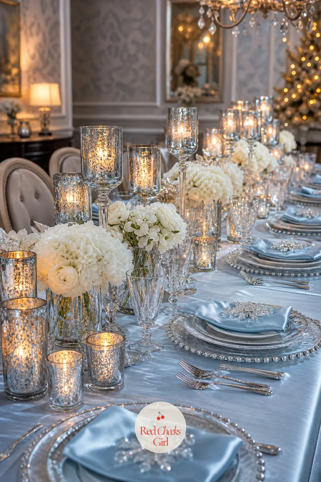 Frosted Tablescape With Mercury Glass Votives — A table set only with plates and glasses looks unfinished the moment the food disappears, and this is the layer