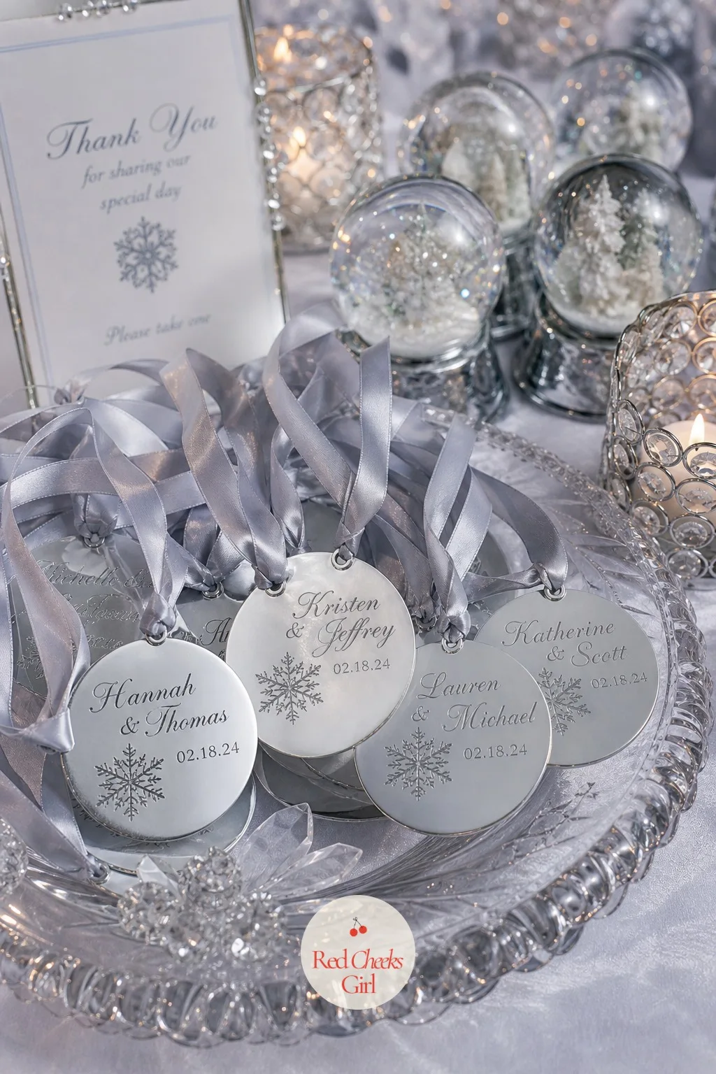 Personalized Silver Ornament Favors — Not every guest wants to pack a glass globe home in a suitcase, so a flatter alternative sitting beside the snow globes