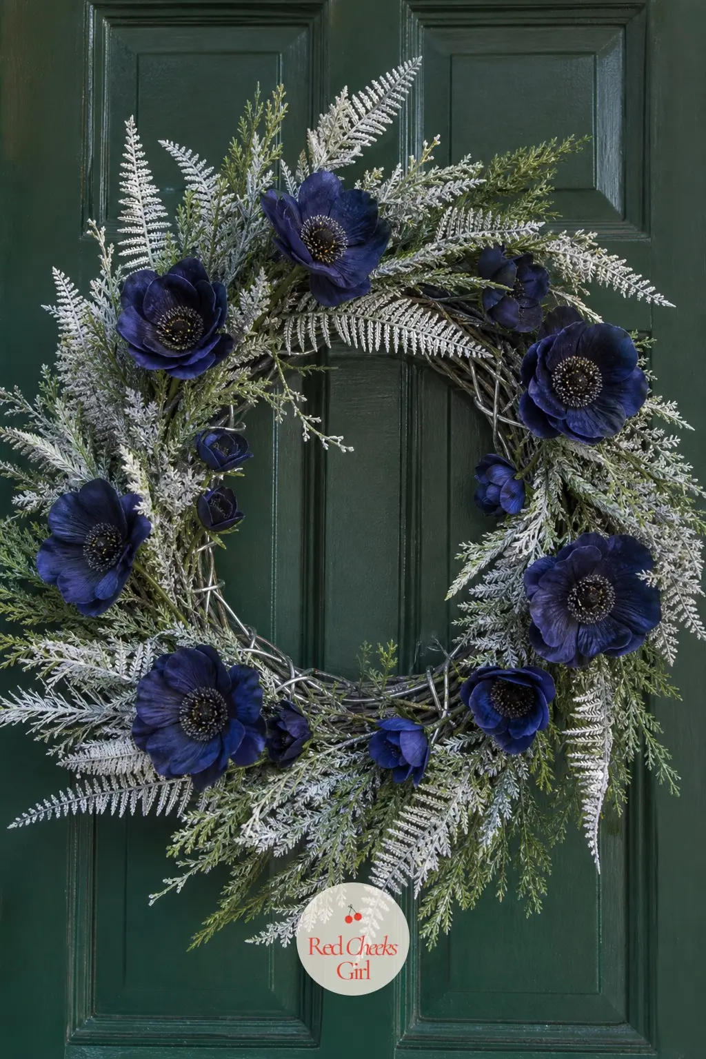 Indigo Anemone and Frosted Fern Door Wreath — Deep indigo silk anemones, nearly black at the centre, sit against pale frosted fern fronds for a door wreath