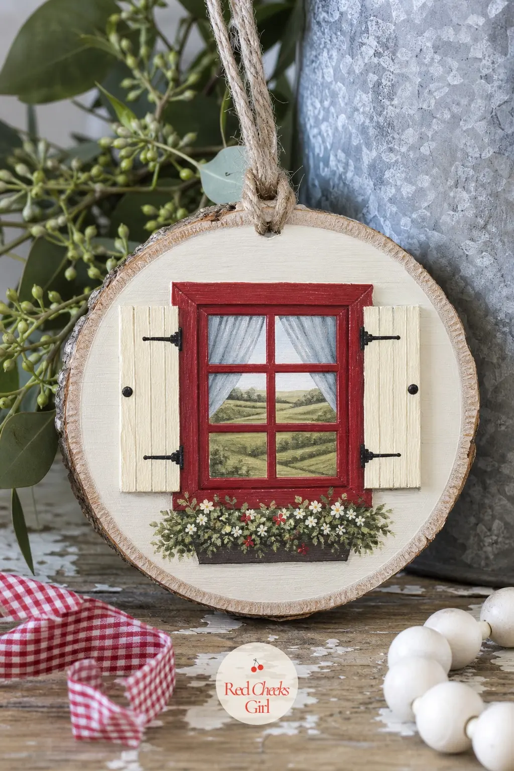 Farmhouse Window Slice — A plain wood slice reads as nothing until a tiny barn red window frame goes on, square and a little crooked on purpose. Wood ornament