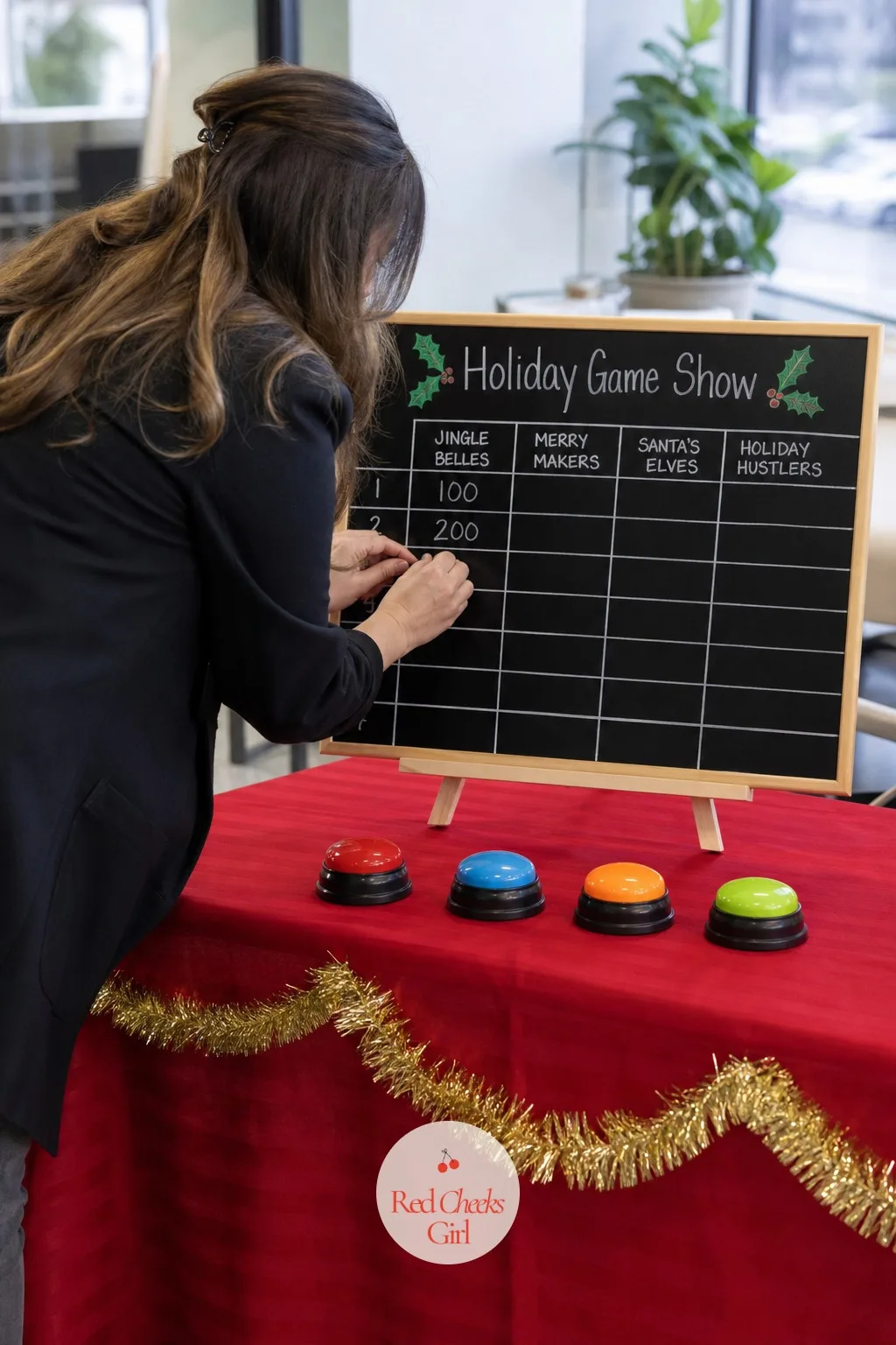 Holiday Game Show With Teams — Split the office into teams of six or seven and the whole afternoon turns into something closer to a live television taping than