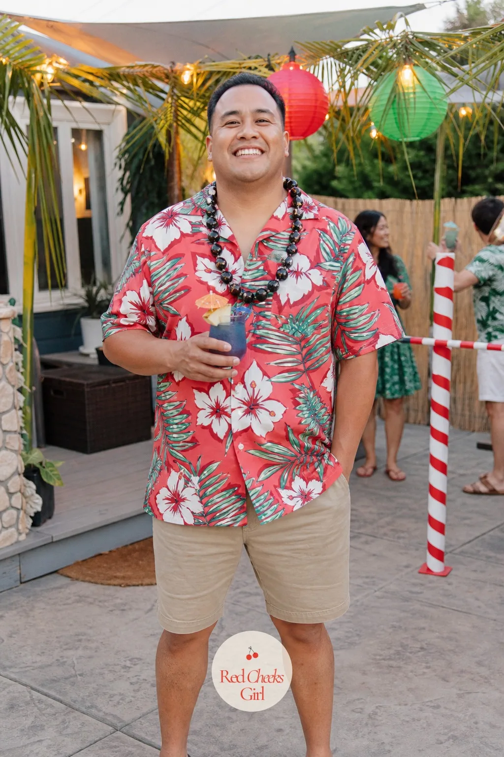 Hawaiian Luau in December — The joke is the whole point: red and green paper lanterns hung between actual palm leaves (real or silk), tiki torches swapped for